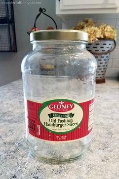 an empty glass jar sitting on top of a counter