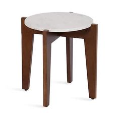 a small wooden stool with a white marble top and brown legs, against a white background