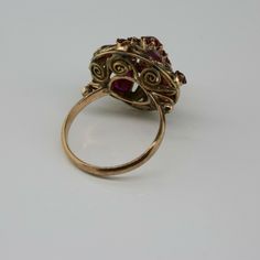 Antique 14K Yellow Gold Ruby Dome Ring, almost rose color gold, .5 inch high, .75 inch across, 4 pear shaped rubies, 12 round rubies, not calibre cut, 3.82 grams, Circa 1940, Size 7. SKU # BB264R25 Most rings are sizable for a small fee. If the ring you are considering is the incorrect size contact us for a quote. This listing contains photographs of the actual item you will receive. Our items are in excellent condition with little or no signs of wear and many are one of a kind pre-owned estate Vintage Multi-stone Ruby Ring In 14k Gold, Antique 14k Gold Ruby Ring With Multi-stone, Vintage 14k Gold Multi-stone Ruby Ring, Antique Rose Gold Ruby Ring For Formal Occasions, Pear-shaped Ruby Rings With Rose Cut Diamonds, Antique 14k Stamped Ruby Ring, Victorian Style Ruby Ring Stamped 14k, Antique Rose Gold Ruby Ring With Gemstone, Victorian Rose Gold Ruby Ring For Formal Occasions