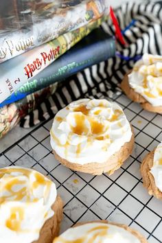 These Harry Potter inspired cookies are absolutely magical! The combination of vanilla and butterscotch topped with a whipped “foam” frosting makes this a cookie perfect for wizards and muggles alike! This butterscotch flavored cookie is perfectly chewy with crisp edges like a sugar cookie. And if that weren’t perfect enough, its topped with a super light whipped frosting and a drizzle of butterscotch. | harry potter cookies easy | harry potter cookie recipes | harry potter cookie ideas