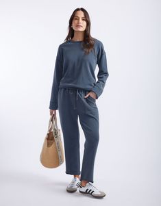 DESCRIPTION Ultra comfortable and oh-so-stylish, you'll love the Raw Edge Lounge Pant from White & Co. Crafted from super soft un-brushed French Terry, these lounge pants are an everyday must-have! These stylish pants feature an elastic waistband, relaxed straight-leg silhouette, front patch pockets and back jet pockets. Considered details like the matching drawcord, top stitch detail colour pop bar tack detail and raw finished hem elevate these weekend essentials. Still browsing? Discover our full range of women's clothing or explore our collection of women's pants. FEATURES & FIT Elastic waistband Matching drawcord with orange bar tack Straight leg silhouette Ankle length Front patch pockets with top stitch detail Back welt jet pockets Designed in Australia True to size Fit: Model is usu Orange Bar, Weekend Essentials, Set Dressing, Colour Pop, Stylish Pants, French Terry Fabric, Lounge Pants, Polished Look, Casual Wardrobe