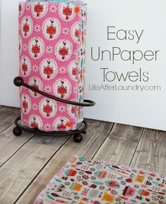 an easy unpaper towel holder made out of fabric and ironing board with wheels