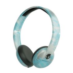 a pair of headphones with blue and white designs on the front, one has a skull