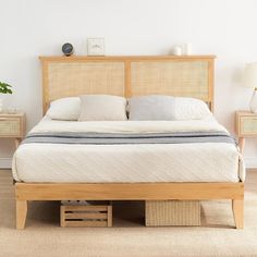 the bed is made and has two nightstands on each side with baskets underneath it