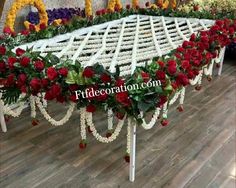 the table is covered with flowers and garlands