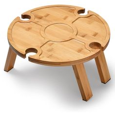 a small wooden table with four holes in the middle and two legs on each side