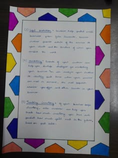 a piece of paper that has been written in different colors and shapes with writing on it