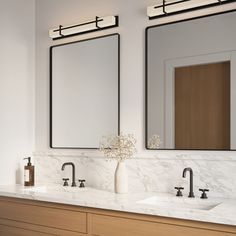 two bathroom sinks with mirrors above them in a white and wood color scheme on the wall