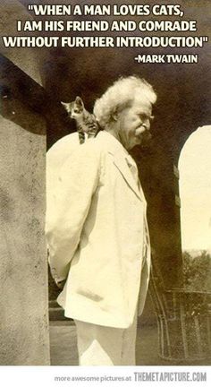 an old black and white photo of a man with a cat on his shoulder looking at him