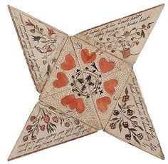 an origami star is decorated with hearts and writing on the bottom, as well as other decorations