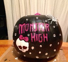 a decorated pumpkin with the words mother high written on it and a skull painted on top