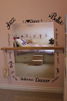 there is a mirror in the room that says dance and ballerinas on it