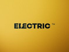 an electric logo is shown on a yellow wall with black lettering that reads,'electric '