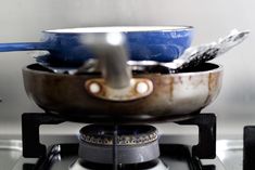 pots and pans are sitting on top of the burners in this kitchen stove