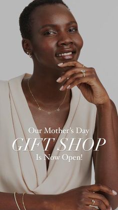 a woman with her hands on her chin and the words, our mother's day gift shop is now open