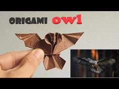 an origami bird is flying in the air