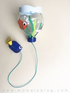 an air balloon shaped like a fish is attached to a cord with a plastic cap on it