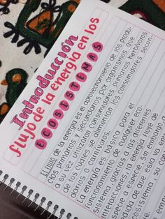 an open notebook with instructions on how to read the text in pink and black ink