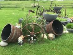 an assortment of garden items sitting in the grass