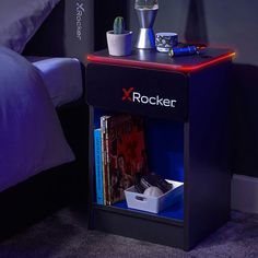 a night stand with an x rocker on it next to a bed