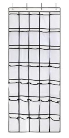 a white and black grid wall hanging on the side of a building with several rows of windows