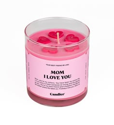 a pink candle with the words i love you written on it