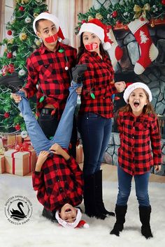 the family is dressed up for christmas in matching outfits