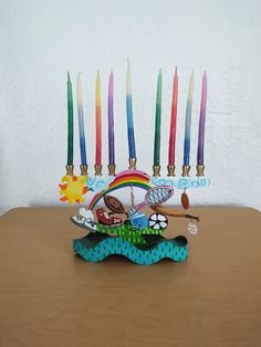 a menorah with candles on it sitting on a table