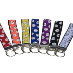 six different colored key chains with hearts on them