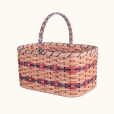 a woven basket with blue and red stripes on the handles is shown in front of a white background