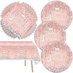 pink and silver birthday party supplies including tablecloths, napkins, plates and cupcake toppers