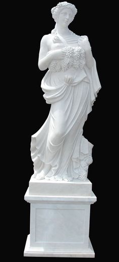 a white statue is shown against a black background