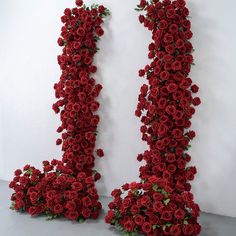 two red roses are arranged in the shape of letters