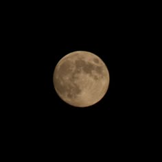 the full moon is seen in the dark sky with no clouds on it's side