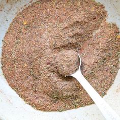 a bowl filled with spices and a spoon