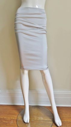 For Sale on 1stDibs - A gorgeous light grey stretch silk skirt from Dolce & Gabbana. It is a pencil style skirt with horizontal ruching across the front and back. There is functional Style Skirt, Silk Skirt, Skirt Fashion, Light Grey, Dolce And Gabbana, Pencil, Lace Up, Silk, Skirt