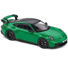 a green sports car on a white background