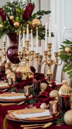 the table is set with gold and red decorations