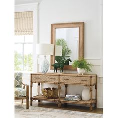 a living room scene with focus on the console table and mirror in the background,