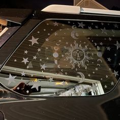 the sun and moon decals are visible on this car's side door window