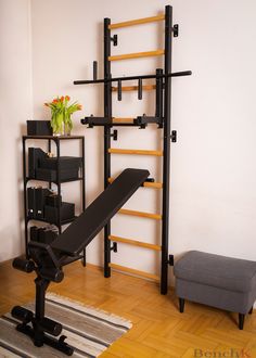 a living room with a chair, book shelf and shelving unit