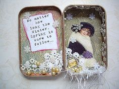 an open tin box with a doll in it and a quote on the inside that says no matter how long the winter spirit is to follow