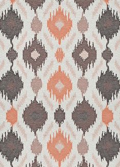 an orange and brown pattern on fabric