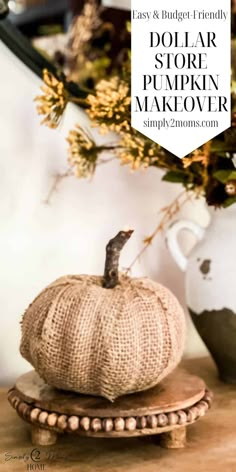 a small pumpkin sitting on top of a wooden stand