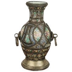 an ornate vase is shown on a white background