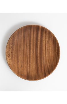 a wooden plate on a white background