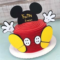 a mickey mouse cake with ears on top