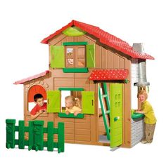 two children playing in a play house with green doors and red roof, while another child plays outside