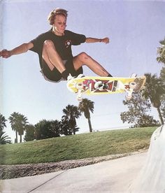 a man flying through the air while riding a skateboard