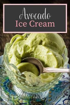 avocado ice cream in a glass bowl on a plate with spoons and text overlay